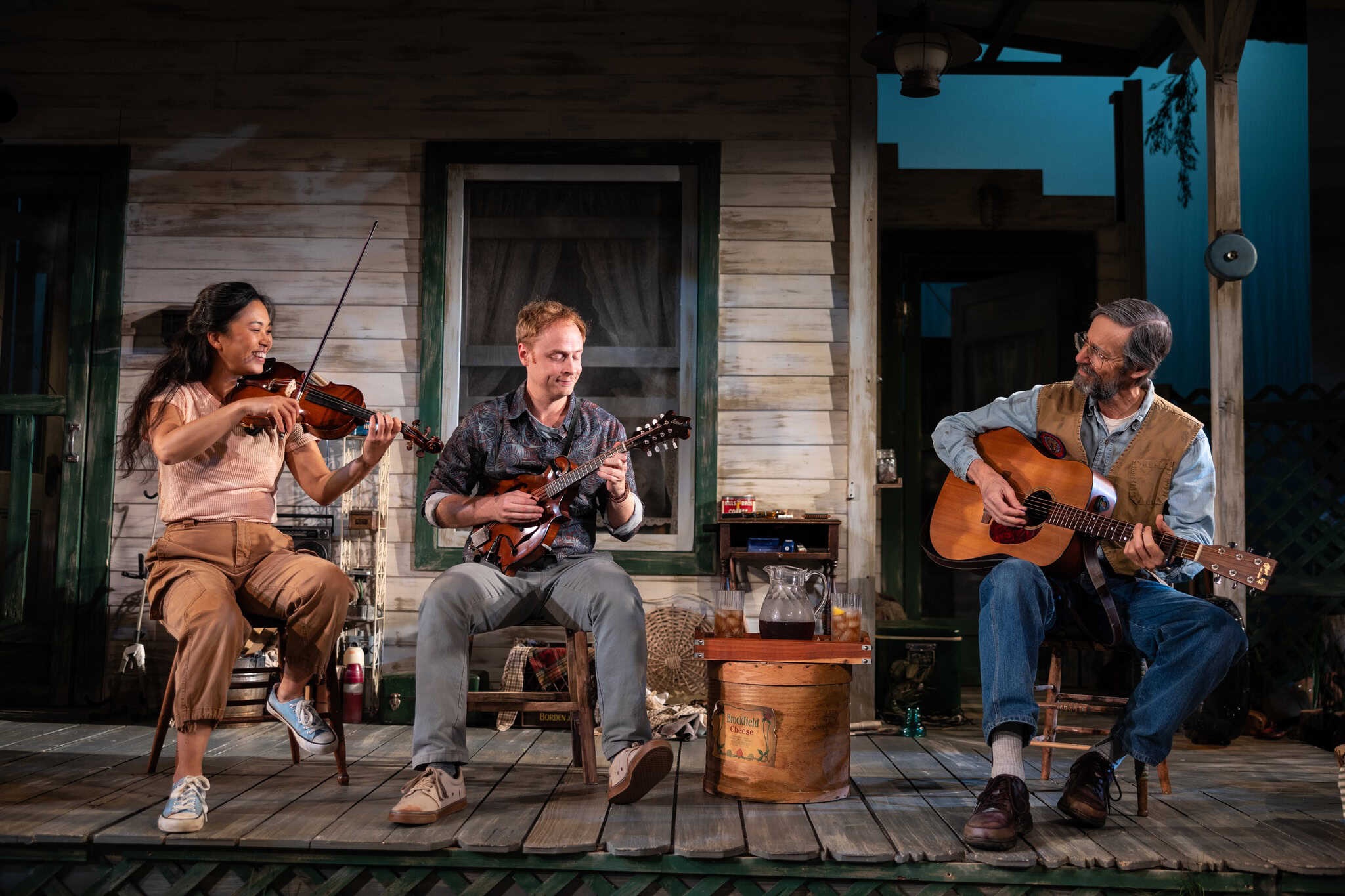 Weston Theater Company Actors Playing Music on Porch Set